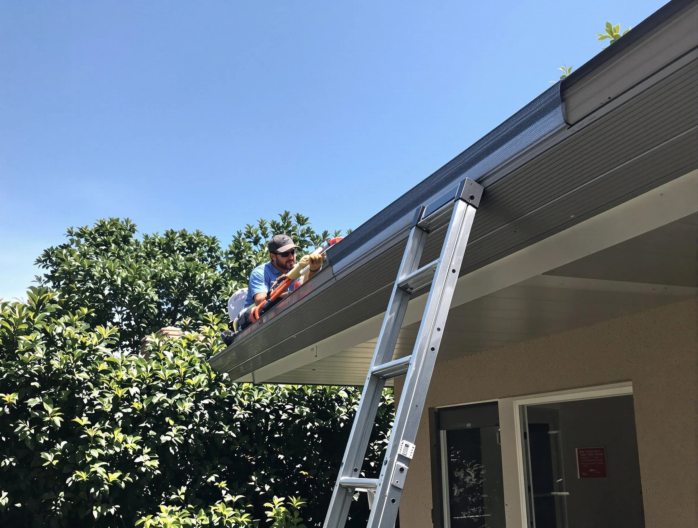 Avon Roofing Company installing gutter guards for a homeowner in Avon, OH